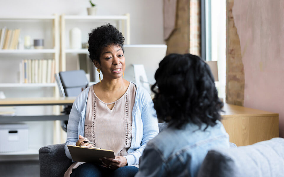 woman talking to therapist